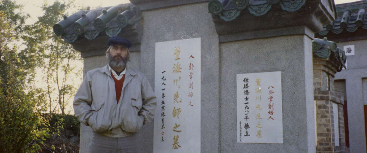Vince Black standing before the grave of Dong Hai Chuan