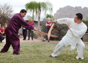 Liu and his son Jack demonstrating a two person broadsword form